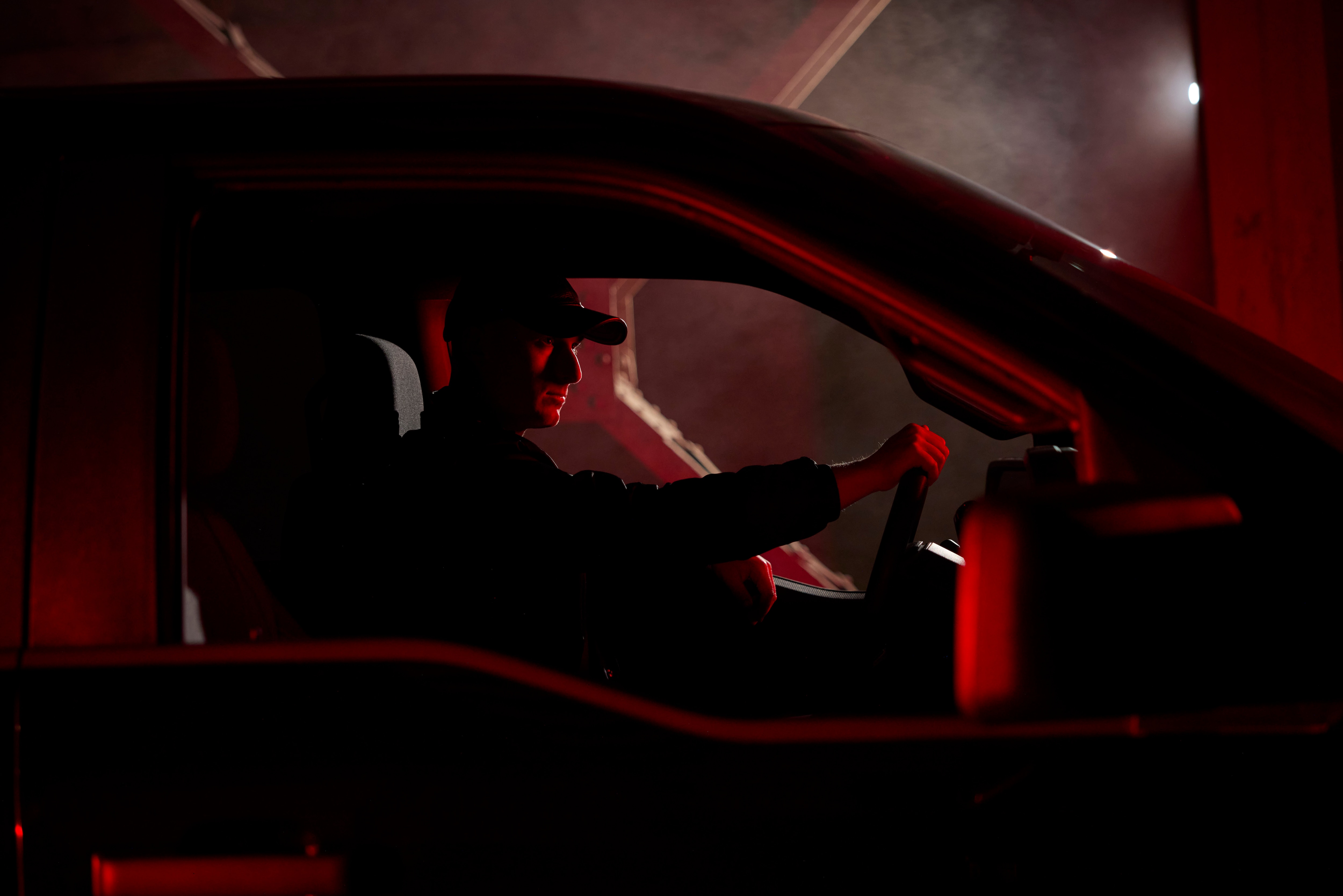 Ford designer Josh Blundo sitting in a 2025 F-150 Lobo. Available Fall 2025.